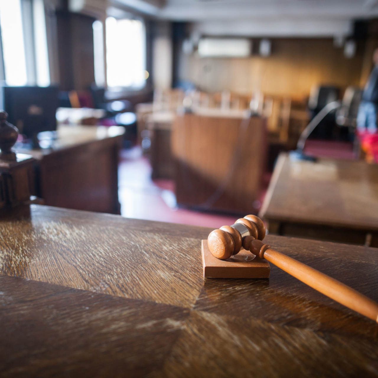 Color image of a hammer in a courtroom.