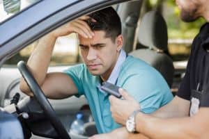 Drunk man caught in car by police officer