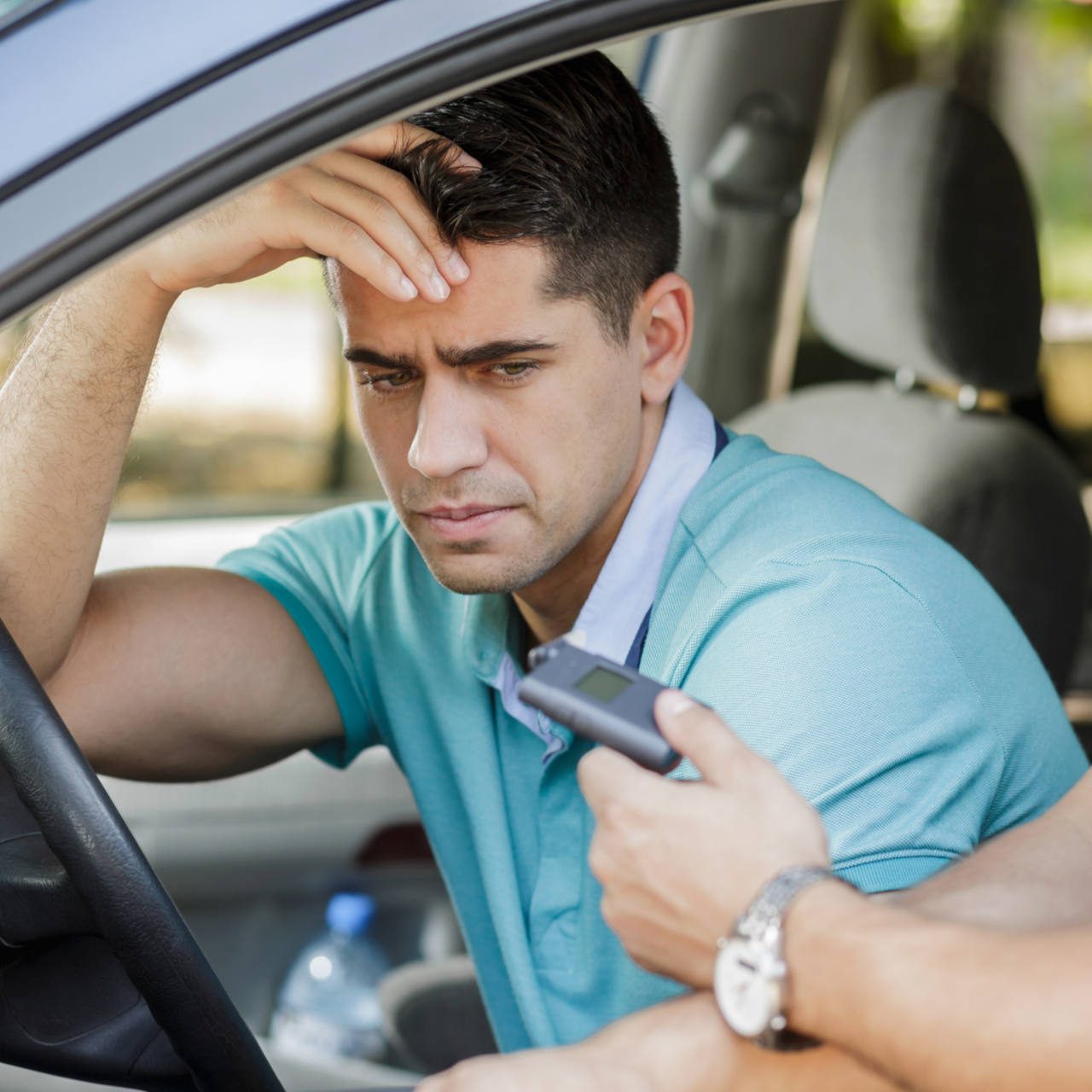 Drunk man caught in car by police officer
