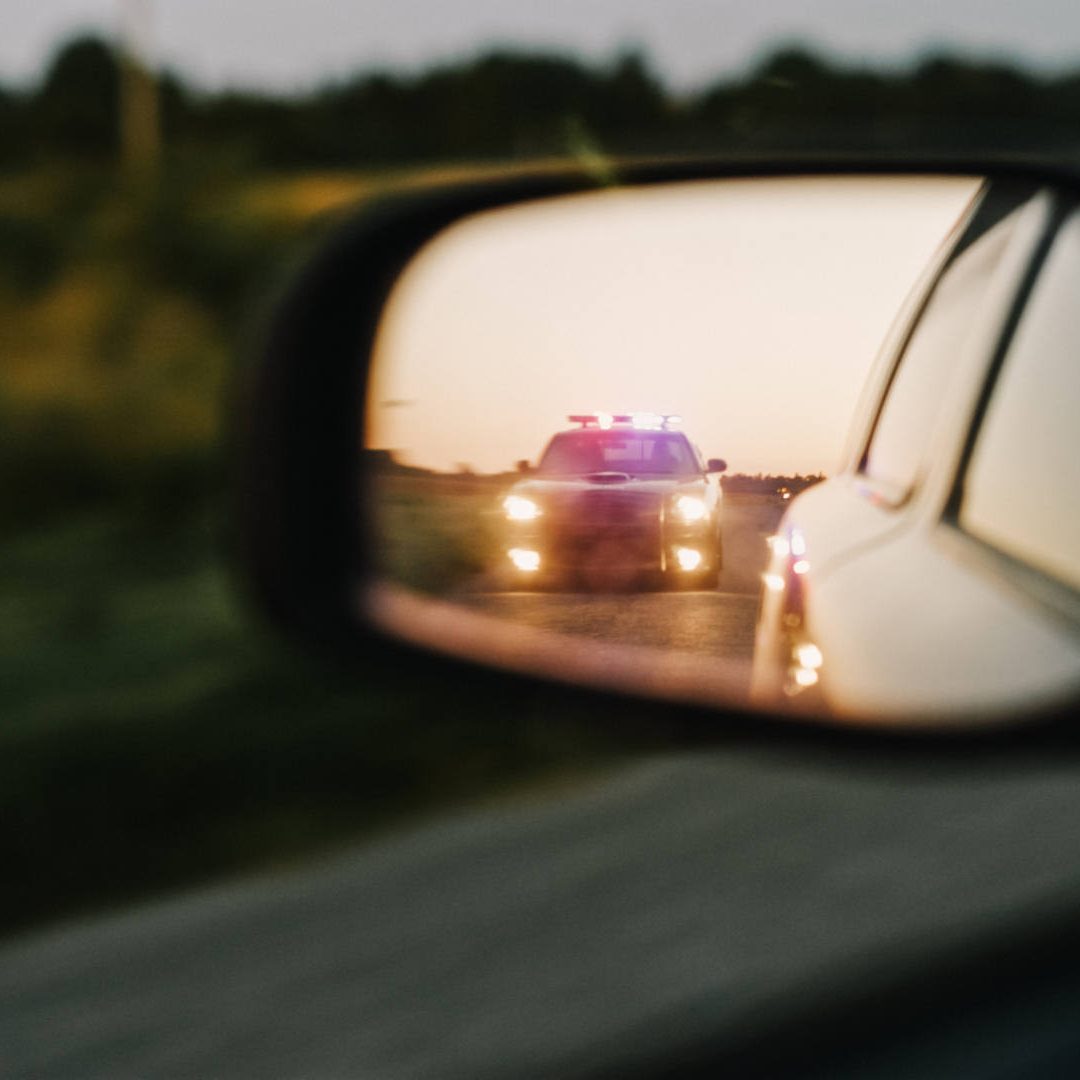 Stylish Side Mirror Car Chase Shot: Highway Traffic Patrol Vehicle Pull over.